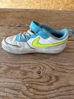 Nike Kids White Sneakers with Blue and Neon Yellow Swoosh